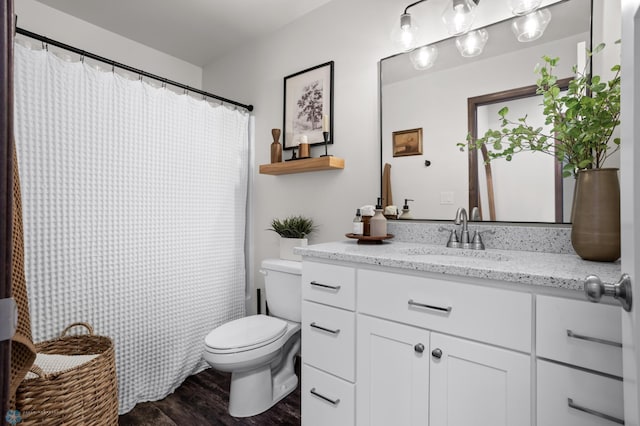 1592 69th Ave S, Fargo, ND 58104 - full bathroom featuring vanity, wood finished floors, and curtained shower