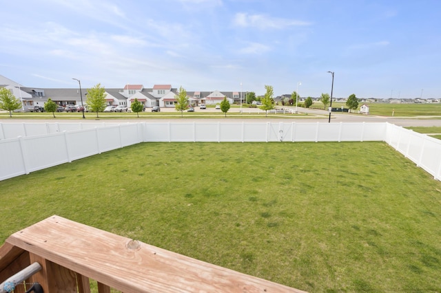 1592 69th Ave S, Fargo, ND 58104 - fenced backyard featuring a residential view
