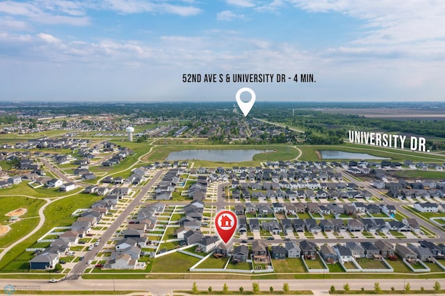 1592 69th Ave S, Fargo, ND 58104 - aerial view of residential area with a nearby body of water