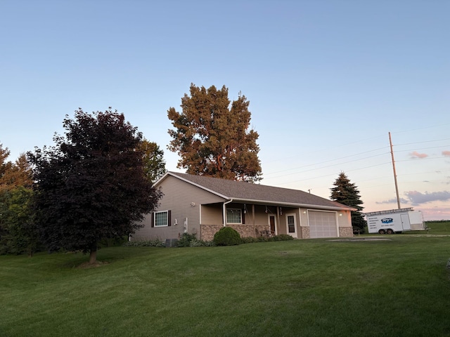 53030 254th Ave, Plainview Twp, MN 55964 - ranch-style house featuring an attached garage, a front lawn, and stone siding