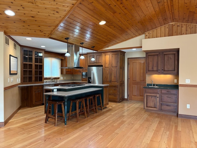 53030 254th Ave, Plainview Twp, MN 55964 - kitchen with stainless steel fridge with ice dispenser, vaulted ceiling, range hood, built in microwave, and wood ceiling