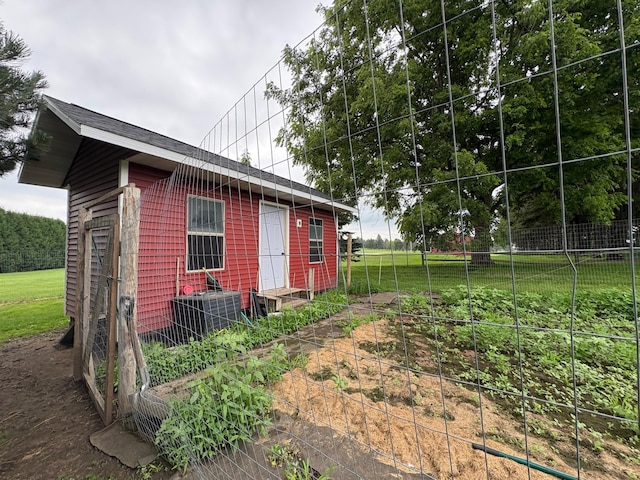 53030 254th Ave, Plainview Twp, MN 55964 - view of property exterior with a vegetable garden and a central AC unit