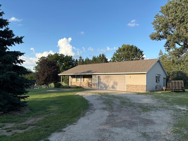 53030 254th Ave, Plainview Twp, MN 55964 - single story home featuring dirt driveway, a garage, and a front lawn