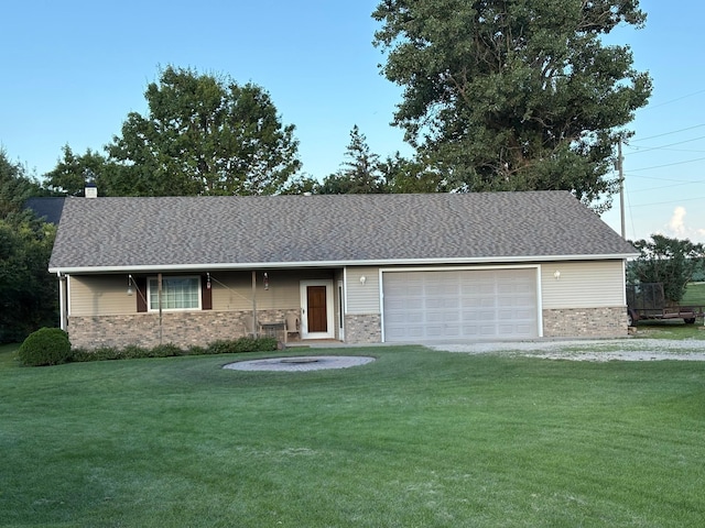 53030 254th Ave, Plainview Twp, MN 55964 - view of front facade featuring a front lawn, brick siding, a garage, driveway, and a shingled roof
