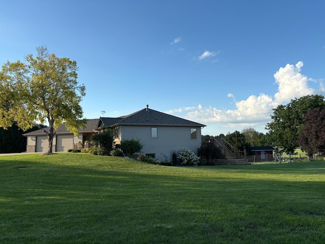 53030 254th Ave, Plainview Twp, MN 55964 - view of side of home with a yard and a garage
