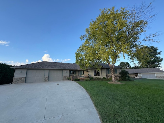 53030 254th Ave, Plainview Twp, MN 55964 - single story home with concrete driveway, an attached garage, a front lawn, and stone siding
