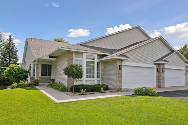 3725 Archer Ln N, Plymouth, MN 55446 - view of front of home featuring brick siding, a shingled roof, a garage, and a front lawn