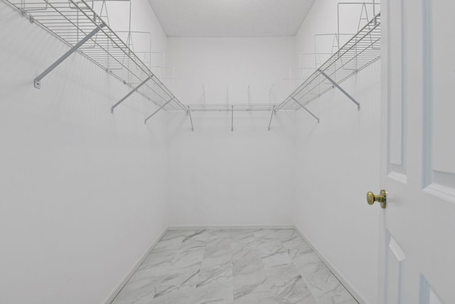 3725 Archer Ln N, Plymouth, MN 55446 - walk in closet with marble look tile flooring