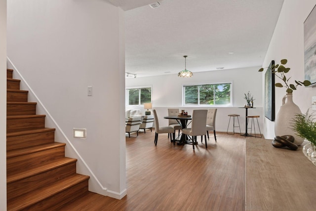 3725 Archer Ln N, Plymouth, MN 55446 - dining space featuring stairs and wood finished floors