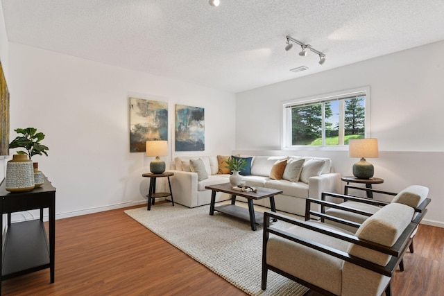 3725 Archer Ln N, Plymouth, MN 55446 - living area featuring track lighting, wood finished floors, and a textured ceiling