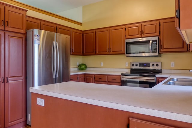 20730 Glenbrook Ave N, Forest Lake, MN 55025 - kitchen featuring stainless steel appliances, light countertops, and a peninsula