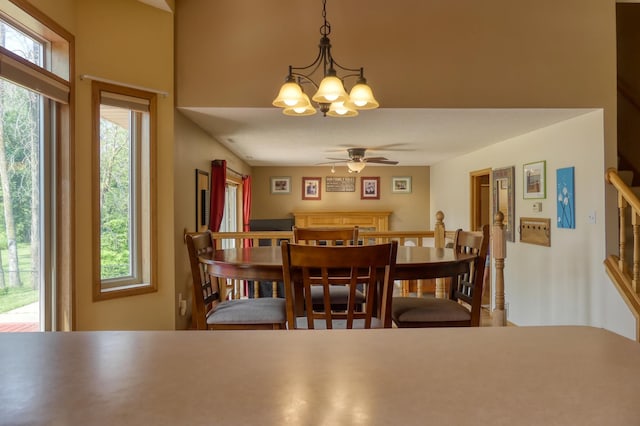 20730 Glenbrook Ave N, Forest Lake, MN 55025 - dining area with a chandelier, ceiling fan, and stairway