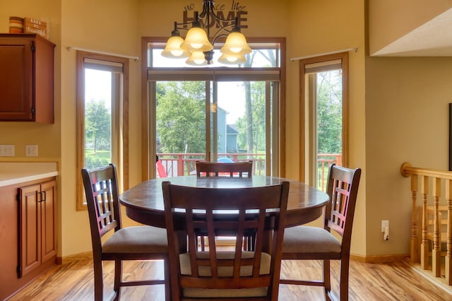 20730 Glenbrook Ave N, Forest Lake, MN 55025 - dining room with a chandelier and light wood-type flooring