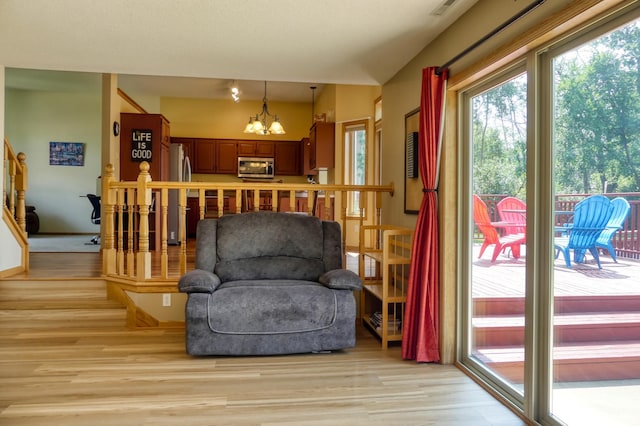 20730 Glenbrook Ave N, Forest Lake, MN 55025 - sitting room featuring light wood-style floors and a chandelier