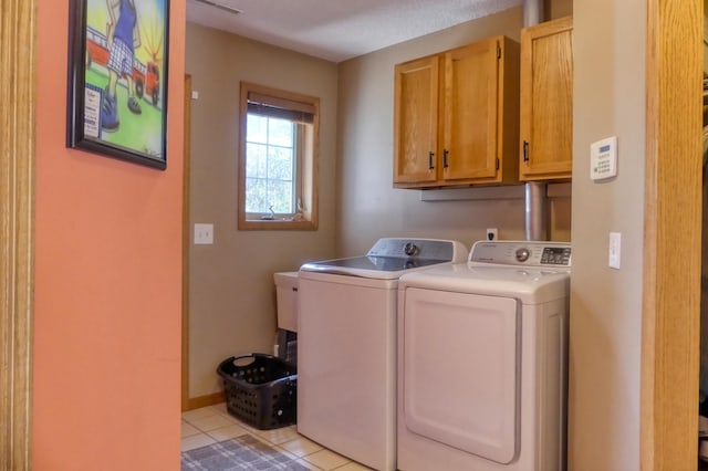 20730 Glenbrook Ave N, Forest Lake, MN 55025 - laundry room with cabinet space, separate washer and dryer, and light tile patterned floors
