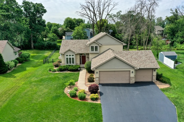 20730 Glenbrook Ave N, Forest Lake, MN 55025 - view of front of home with driveway, an attached garage, a shingled roof, and a front yard