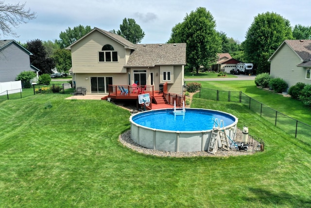 20730 Glenbrook Ave N, Forest Lake, MN 55025 - rear view of house featuring a wooden deck, a fenced backyard, and a shingled roof