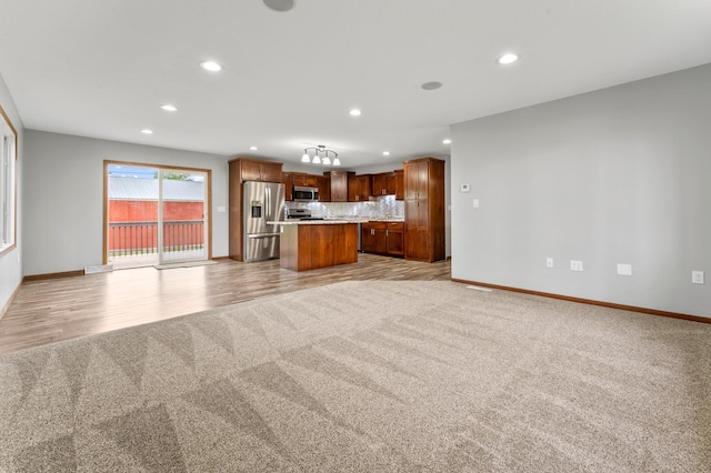 55170 Forest Blvd, Rush City, MN 55069 - unfurnished living room featuring light carpet, recessed lighting, and light wood-type flooring