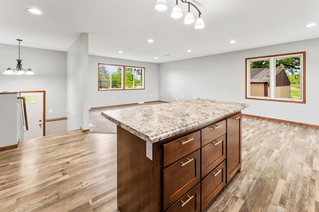 55170 Forest Blvd, Rush City, MN 55069 - kitchen with a chandelier, light countertops, recessed lighting, light wood-style floors, and hanging light fixtures