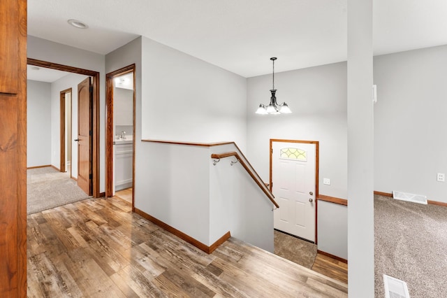 55170 Forest Blvd, Rush City, MN 55069 - entrance foyer with wood finished floors and a chandelier