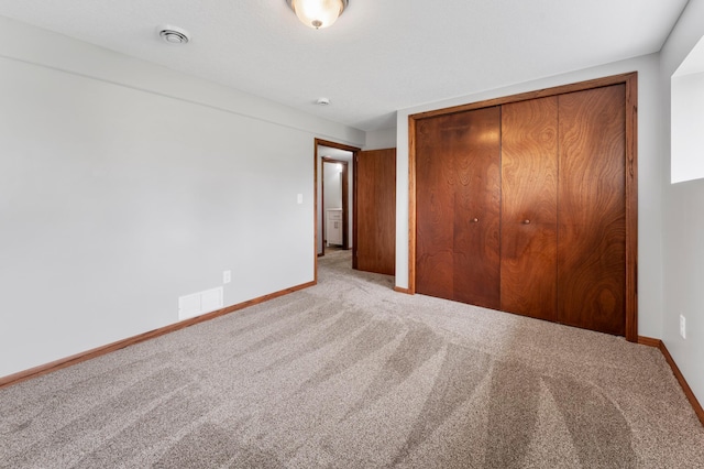 55170 Forest Blvd, Rush City, MN 55069 - unfurnished bedroom featuring carpet flooring and a closet