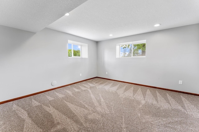 55170 Forest Blvd, Rush City, MN 55069 - carpeted empty room featuring plenty of natural light, recessed lighting, and a textured ceiling