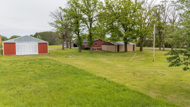 55170 Forest Blvd, Rush City, MN 55069 - view of green lawn with an outbuilding, an outdoor structure, and a garage