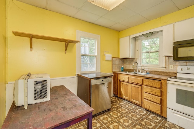 1111 Como Pl, Saint Paul, MN 55103 - kitchen with white electric stove, dishwasher, black microwave, a drop ceiling, and backsplash
