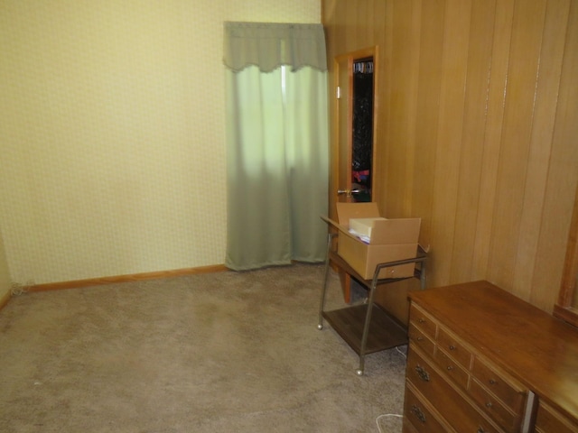 904 12th St N, Benson, MN 56215 - spare room featuring light colored carpet and wallpapered walls