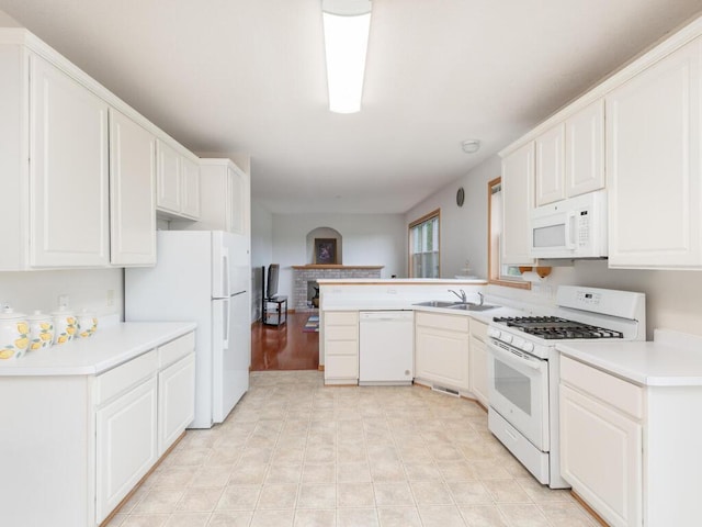 17625 48th Pl N, Plymouth, MN 55446 - kitchen featuring white appliances, a peninsula, light countertops, and white cabinetry