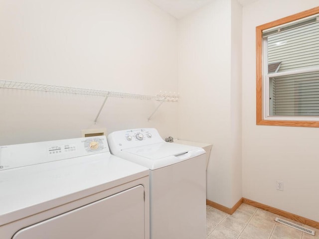 17625 48th Pl N, Plymouth, MN 55446 - laundry area with separate washer and dryer and light tile patterned flooring