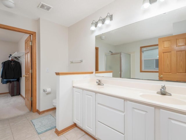 17625 48th Pl N, Plymouth, MN 55446 - full bathroom featuring a shower stall, double vanity, and tile patterned flooring