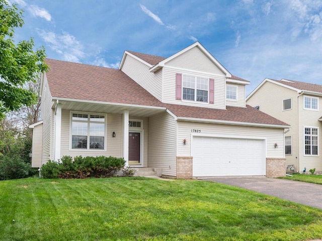 17625 48th Pl N, Plymouth, MN 55446 - traditional-style house featuring driveway, a garage, a front lawn, and roof with shingles