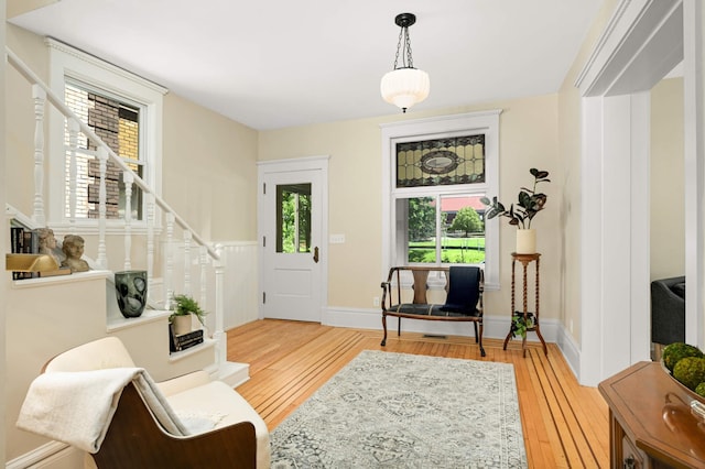2636 Harriet Ave, Minneapolis, MN 55408 - foyer entrance featuring light wood finished floors and stairway