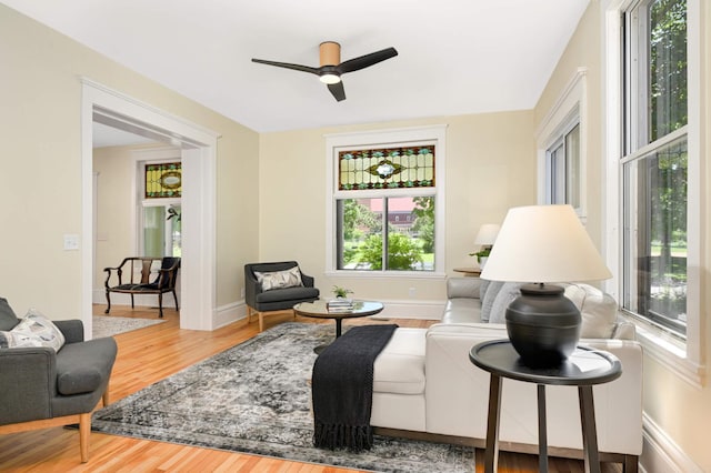 2636 Harriet Ave, Minneapolis, MN 55408 - living room with healthy amount of natural light, wood finished floors, and a ceiling fan