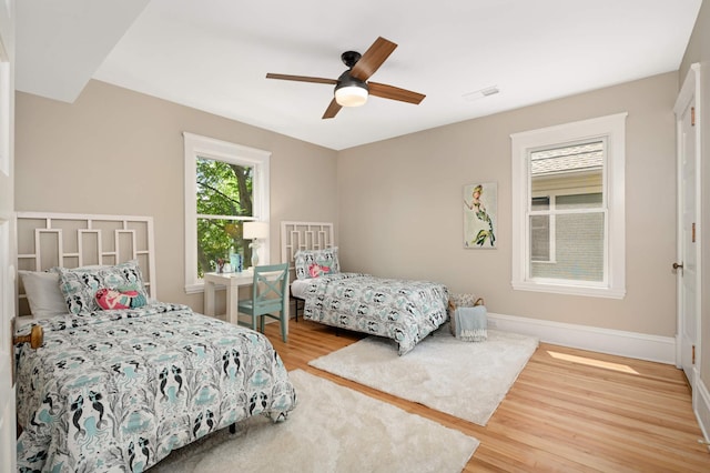 2636 Harriet Ave, Minneapolis, MN 55408 - bedroom with wood finished floors and a ceiling fan