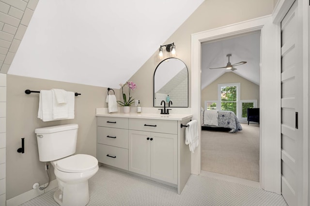 2636 Harriet Ave, Minneapolis, MN 55408 - ensuite bathroom featuring lofted ceiling, a ceiling fan, vanity, and tile patterned floors