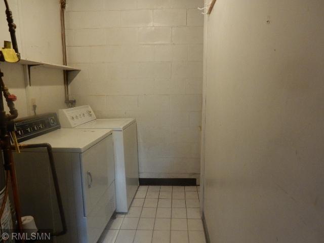 2169 78th Ct E, Inver Grove Heights, MN 55077 - laundry area featuring independent washer and dryer and light tile patterned floors