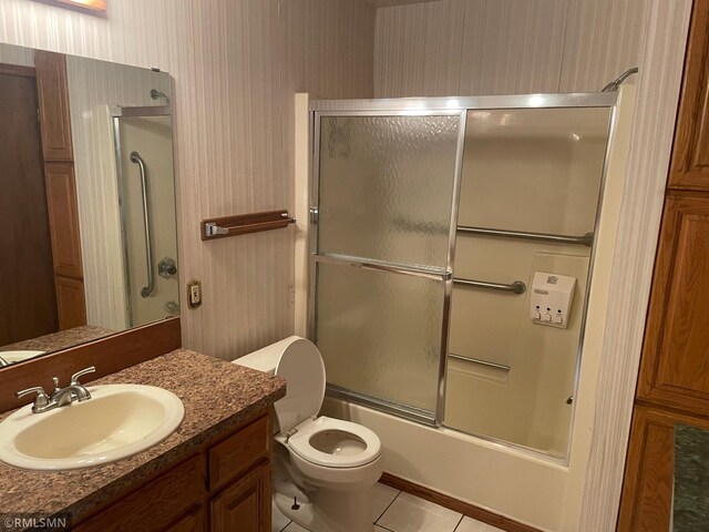 2169 78th Ct E, Inver Grove Heights, MN 55077 - bathroom featuring vanity, enclosed tub / shower combo, tile patterned flooring, and wallpapered walls