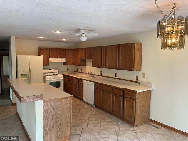 2169 78th Ct E, Inver Grove Heights, MN 55077 - kitchen with white appliances, under cabinet range hood, ceiling fan, light countertops, and a textured ceiling