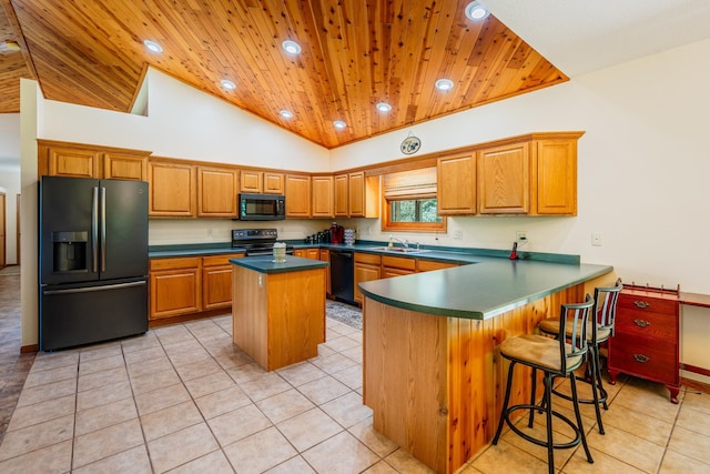W5136 Hale Ct, Farmington Twp, WI 54636 - kitchen with black appliances, wooden ceiling, a kitchen island, light tile patterned floors, and a peninsula