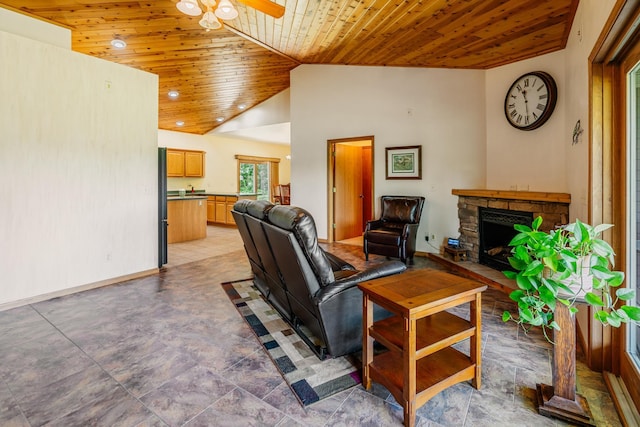 W5136 Hale Ct, Farmington Twp, WI 54636 - living area with wood ceiling, ceiling fan, a stone fireplace, and lofted ceiling