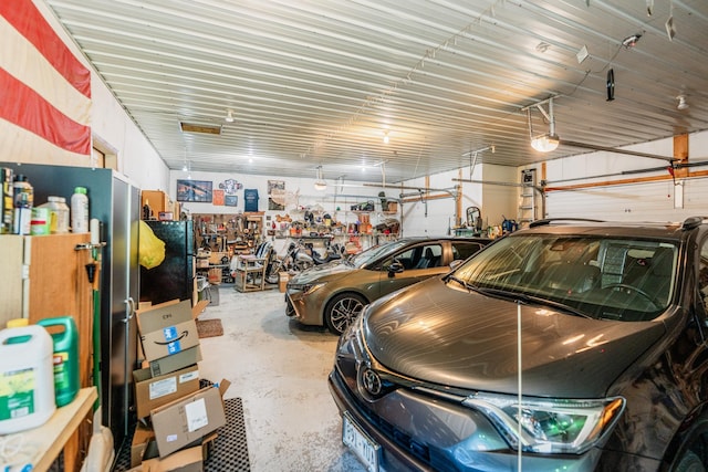 W5136 Hale Ct, Farmington Twp, WI 54636 - garage featuring a garage door opener