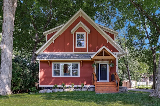 2794 Casco Point Rd, Orono, MN 55391 - view of front of property featuring entry steps, a front lawn, a shingled roof, and board and batten siding