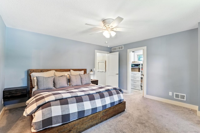 2794 Casco Point Rd, Orono, MN 55391 - carpeted bedroom featuring ceiling fan and a walk in closet
