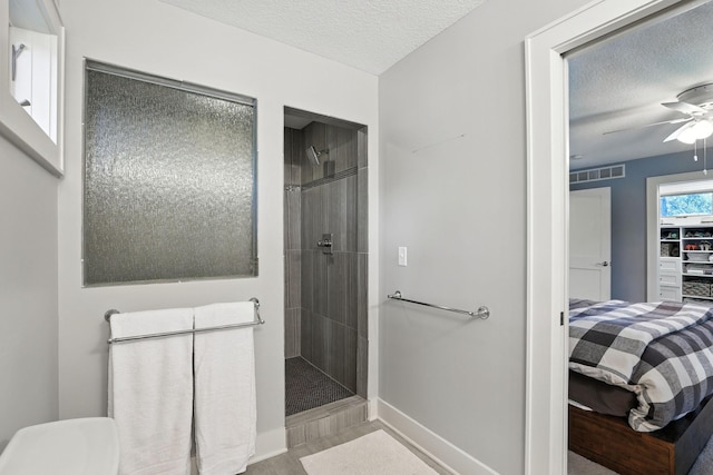 2794 Casco Point Rd, Orono, MN 55391 - ensuite bathroom featuring a tile shower, a textured ceiling, and ceiling fan