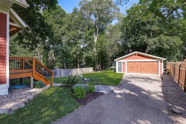 2794 Casco Point Rd, Orono, MN 55391 - view of yard with a garage, an outdoor structure, stairs, and view of wooded area