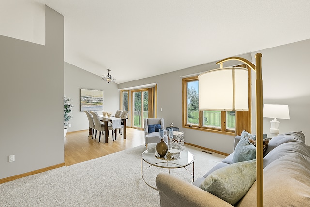 10374 61st St NE, Albertville, MN 55301 - living room with light wood-type flooring and vaulted ceiling