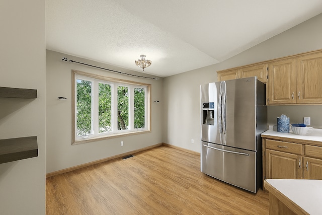 10374 61st St NE, Albertville, MN 55301 - kitchen featuring stainless steel fridge with ice dispenser, light wood finished floors, light countertops, and light brown cabinetry