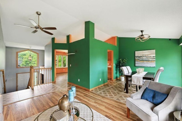 10374 61st St NE, Albertville, MN 55301 - living area featuring vaulted ceiling, wood finished floors, and ceiling fan